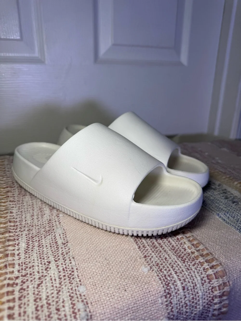 Nike Calm White Slide Sandals.